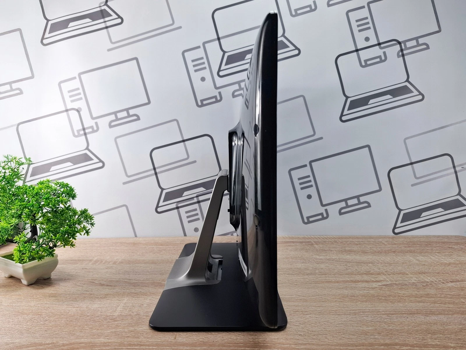 Side view of refurbished 22-inch EloTouch 2201L black Full HD SAW USB touchscreen monitor on stand for retail and hospitality POS use