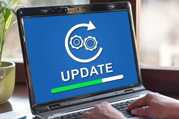 Laptop showing a software update, representing MagicPOS ServicePlus VIP Support with daily cloud backups and remote help for GastroSoft and PosSoft POS systems