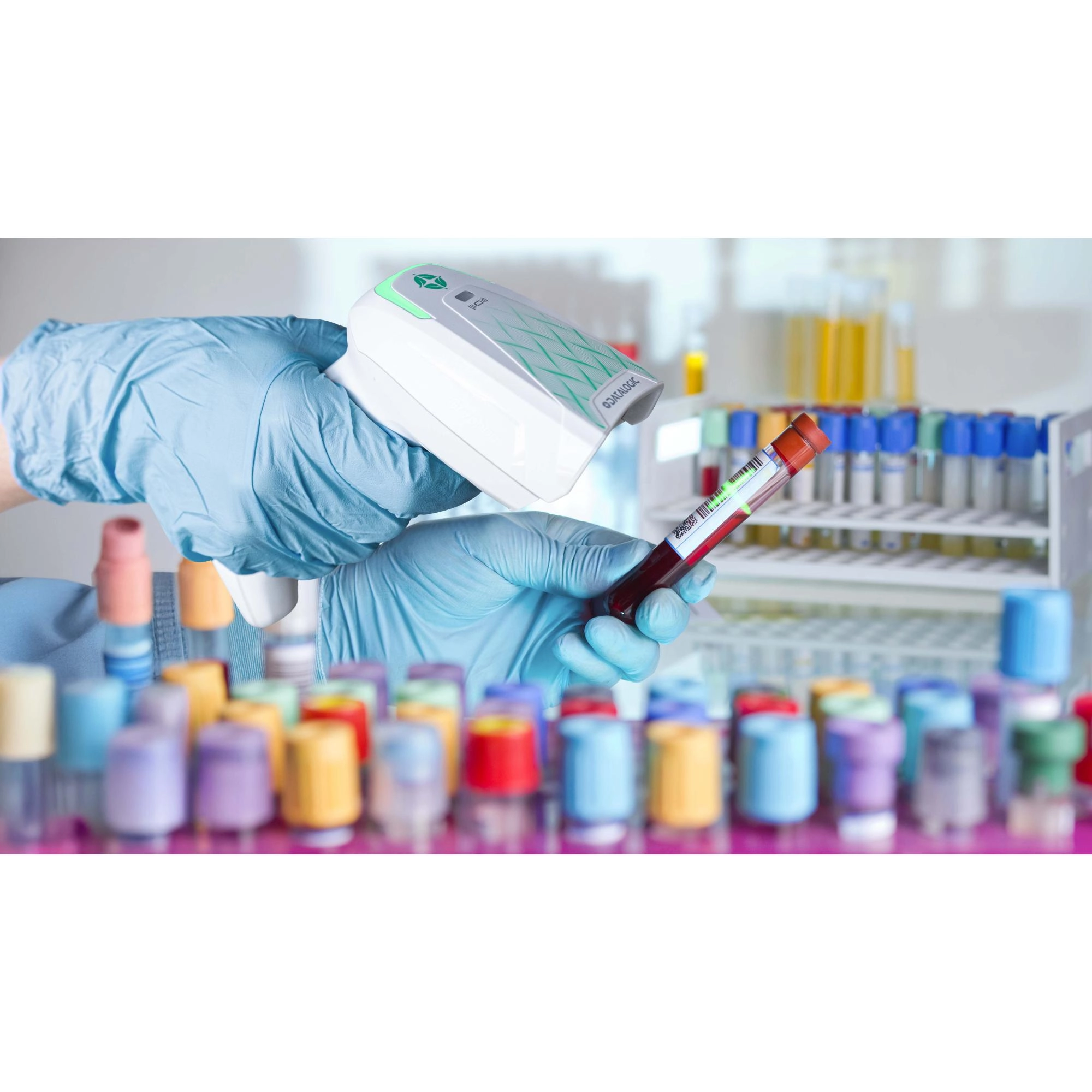 Datalogic Gryphon GM4600 HC wireless 1D/2D healthcare barcode scanner scanning a blood sample tube in a laboratory